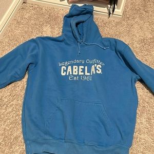 Cabelas blue sweatshirt; barley worn